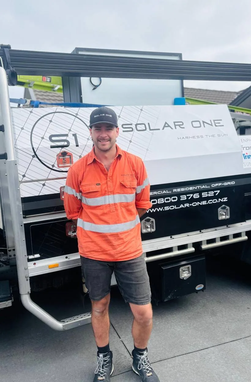 Brad Lynch of Solar One in front of the branded work truck